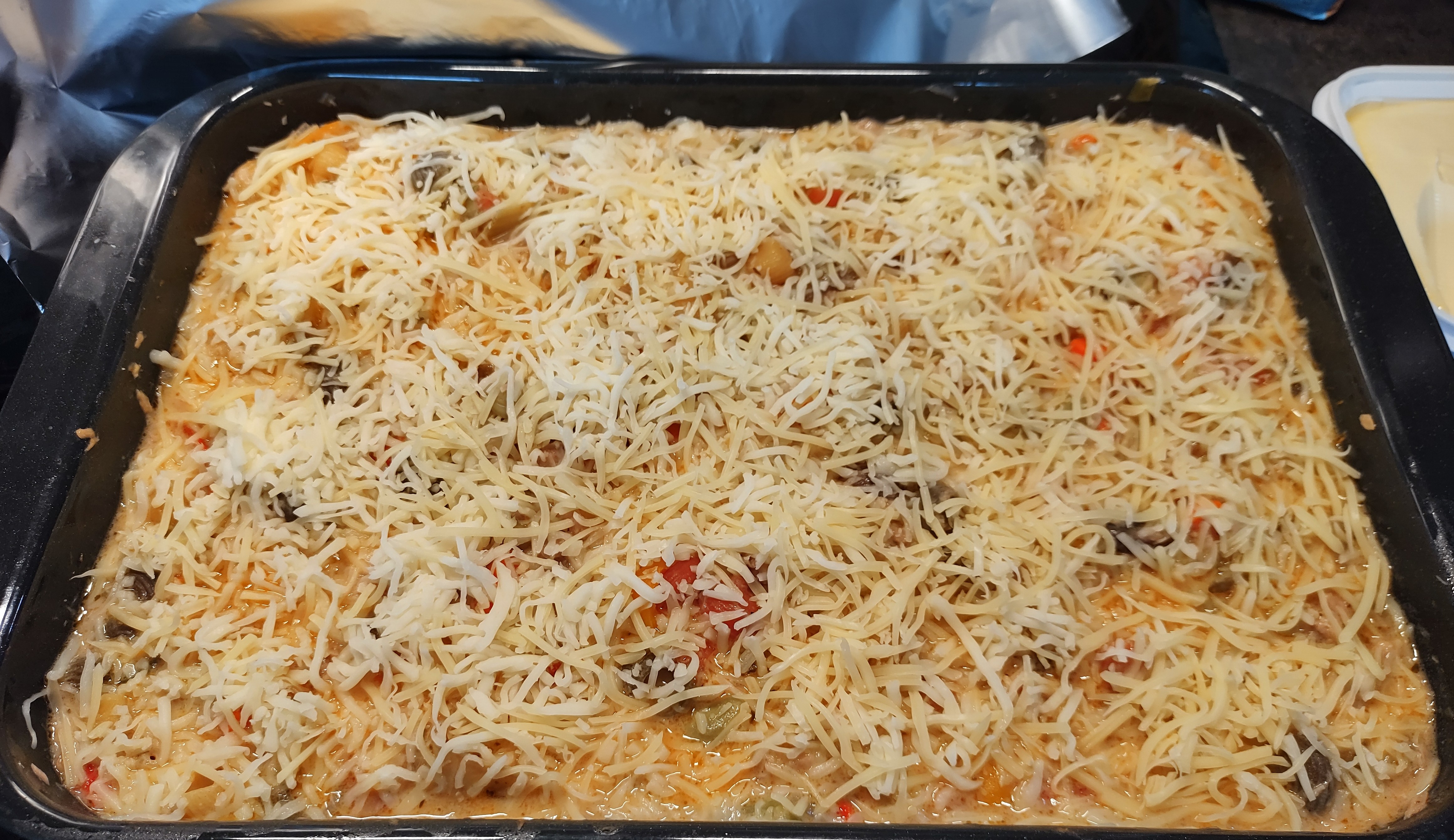Right before covering the dish with aluminum foil